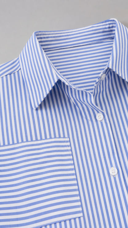 Close-up detail of blue striped shirt collar and chest pocket