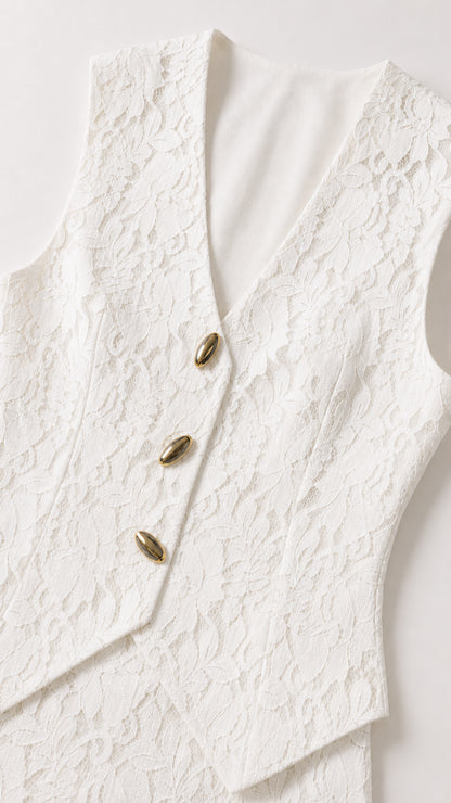 Close up of white lace vest detailing and buttons