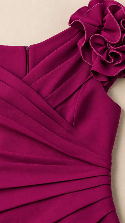 Close-up of fuchsia dress shoulder rosette and bodice