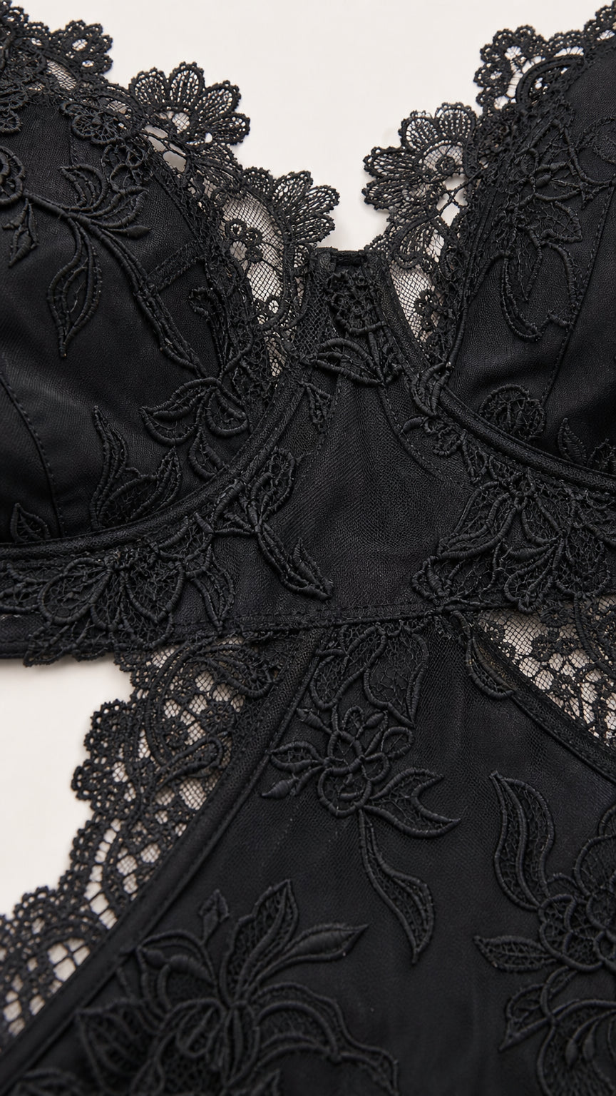 Close up detail of black floral lace bodice and cutout