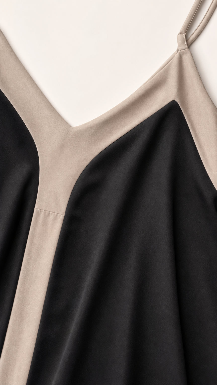 Close-up detail of V-neckline and contrast panel