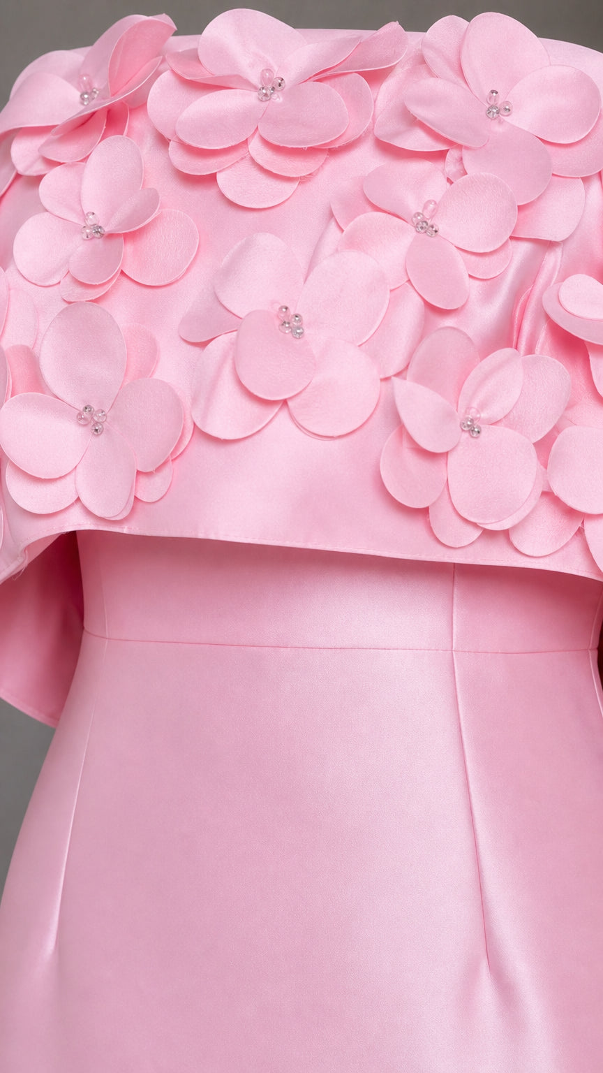 Close-up detail of 3D floral embellishments on the bodice