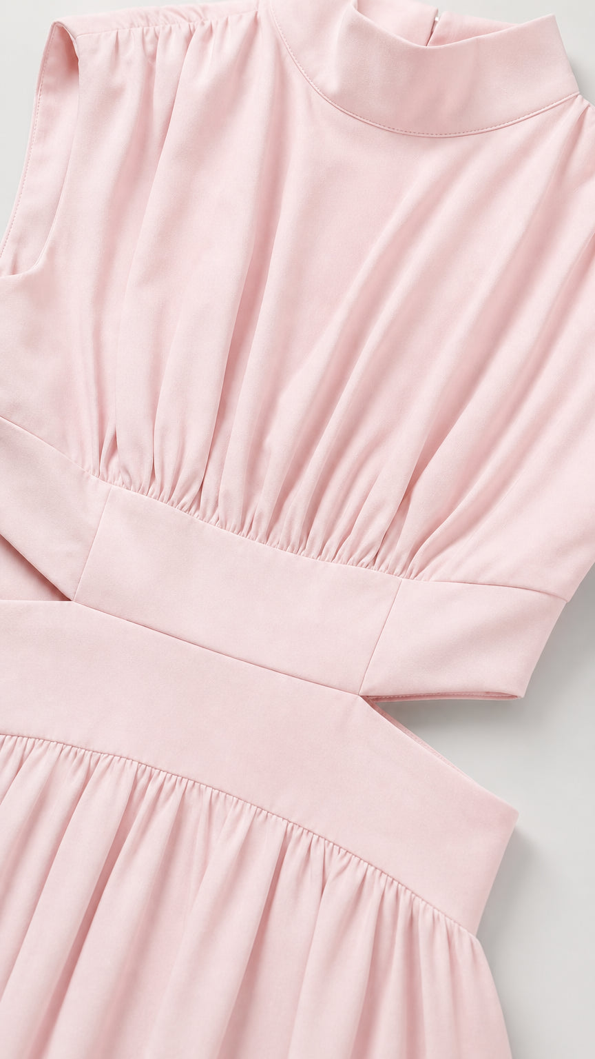 Close-up detail of pleated mock neck bodice and waist cutout