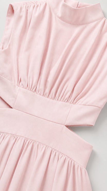 Close-up detail of pleated mock neck bodice and waist cutout
