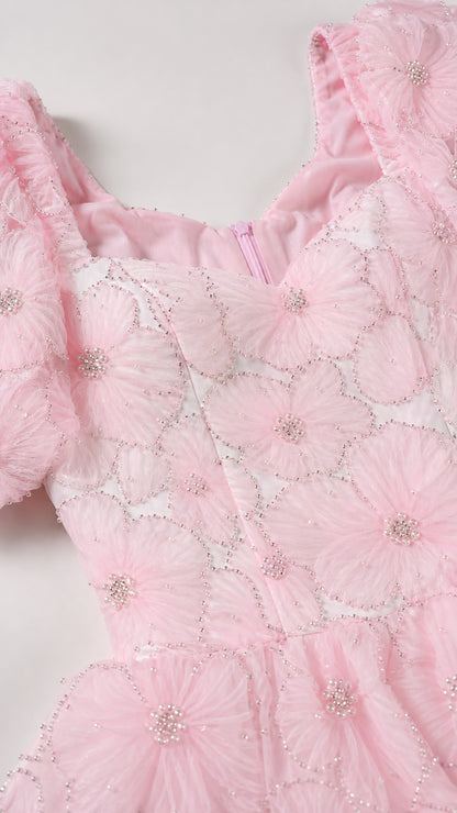 Close-up detail of sweetheart neckline and floral applique texture