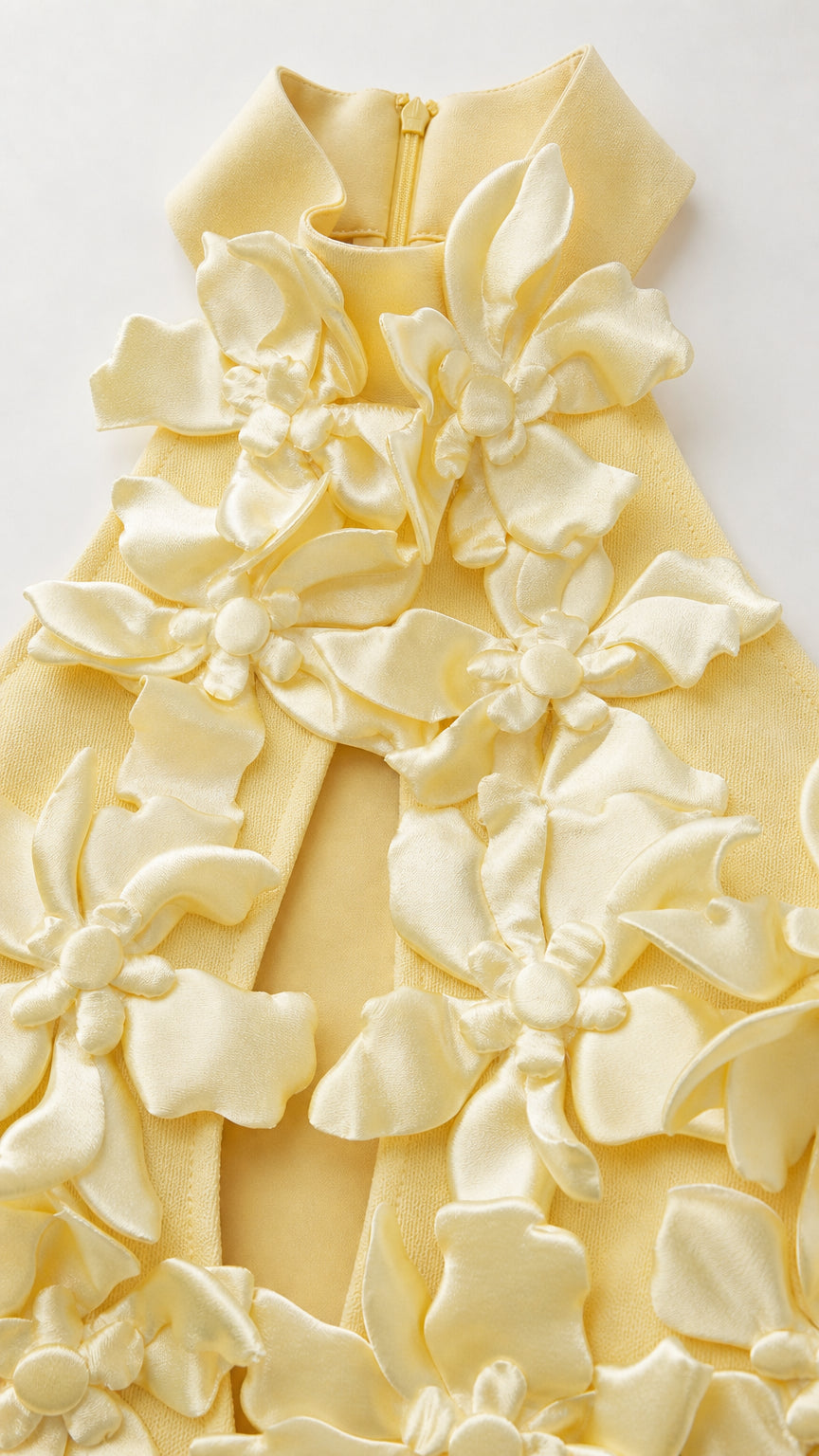Close-up detail of yellow 3D fabric flowers and halter collar