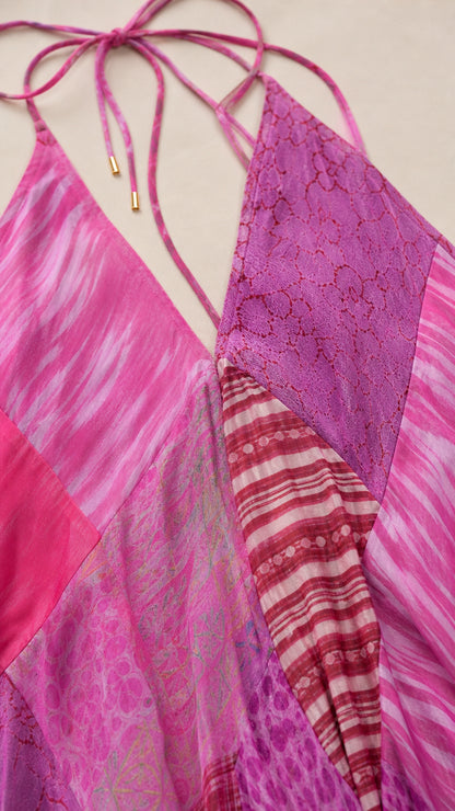 Close-up detail of halter straps and patchwork fabric texture