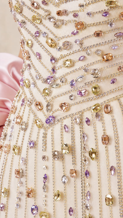 Close-up detail of multi-colored crystal beadwork on bodice
