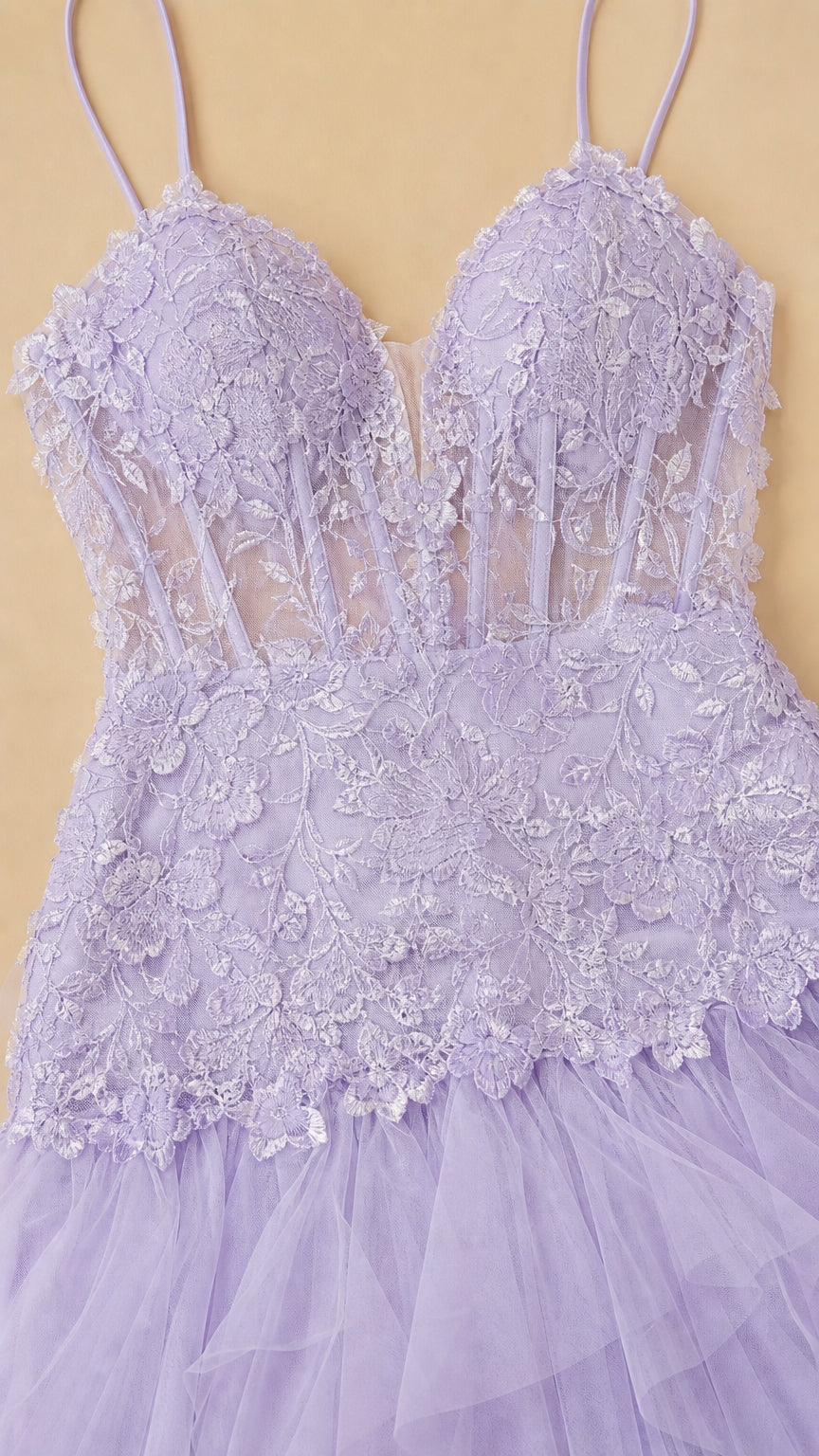 Close-up detail of sheer corset bodice with floral lace and boning in lavender