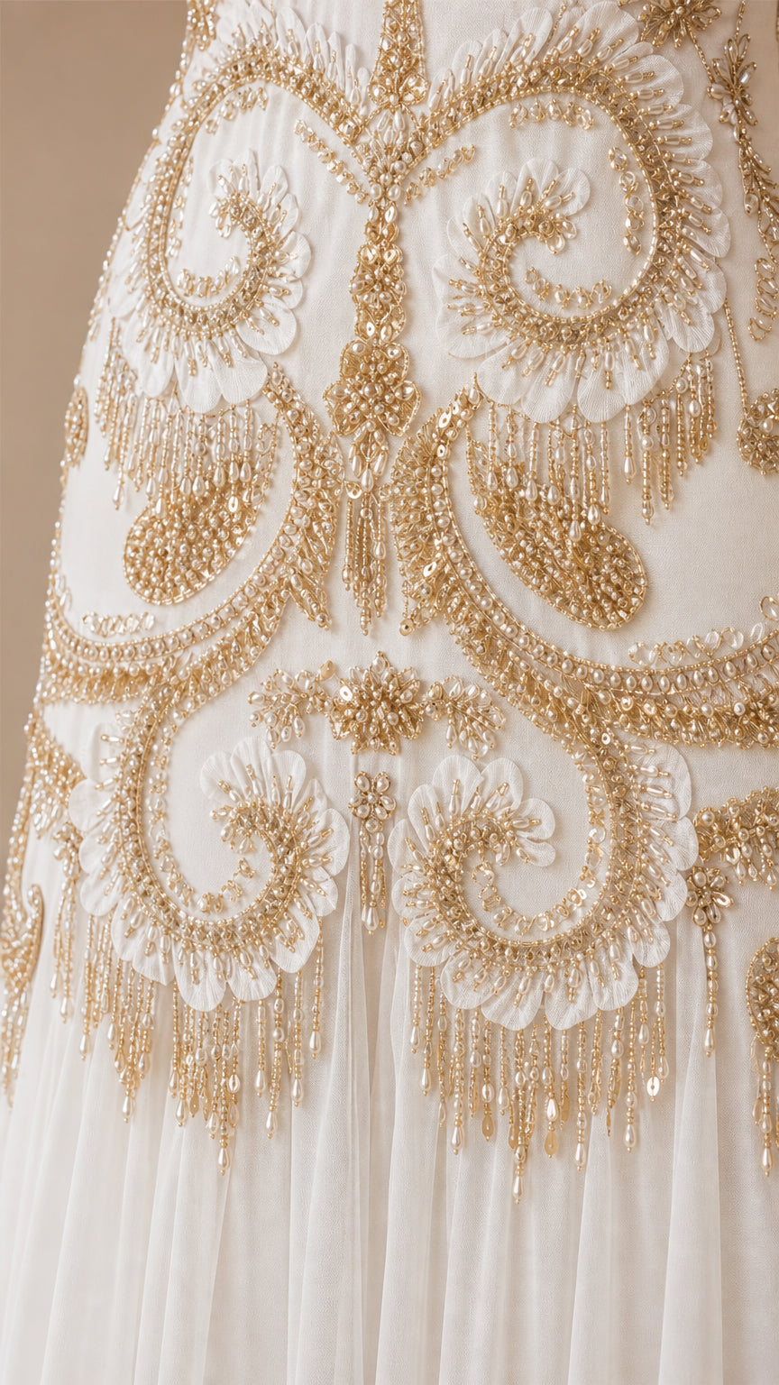 Close-up detail of gold embroidery and beadwork on the dress