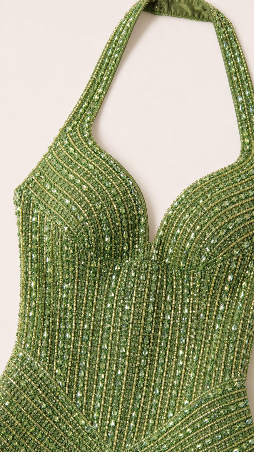 Close-up detail of halter neckline and beadwork on green dress