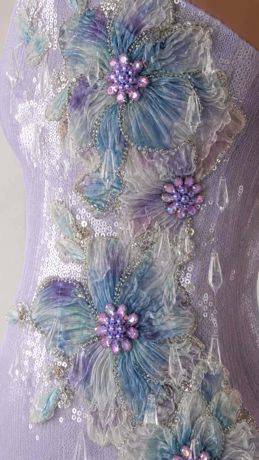 Close-up of 3D floral appliques and sequin detail on lavender dress