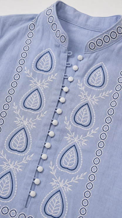 Close-up of front button placket and embroidery details