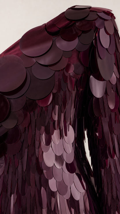Close-up detail of oversized sequins and fringe texture