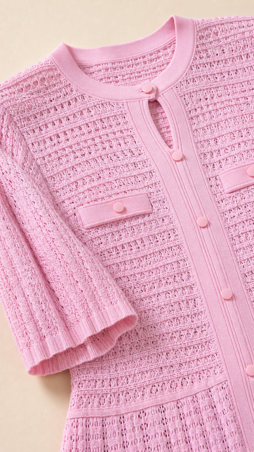 Close-up detail of pink knit dress bodice and sleeves