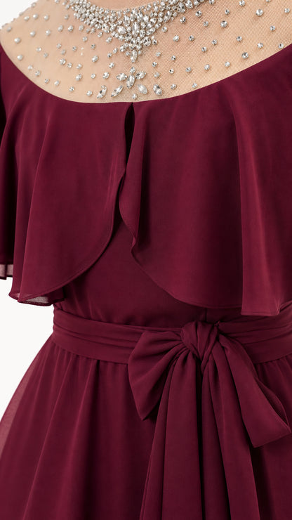 Close-up detail of rhinestone sheer yoke and capelet