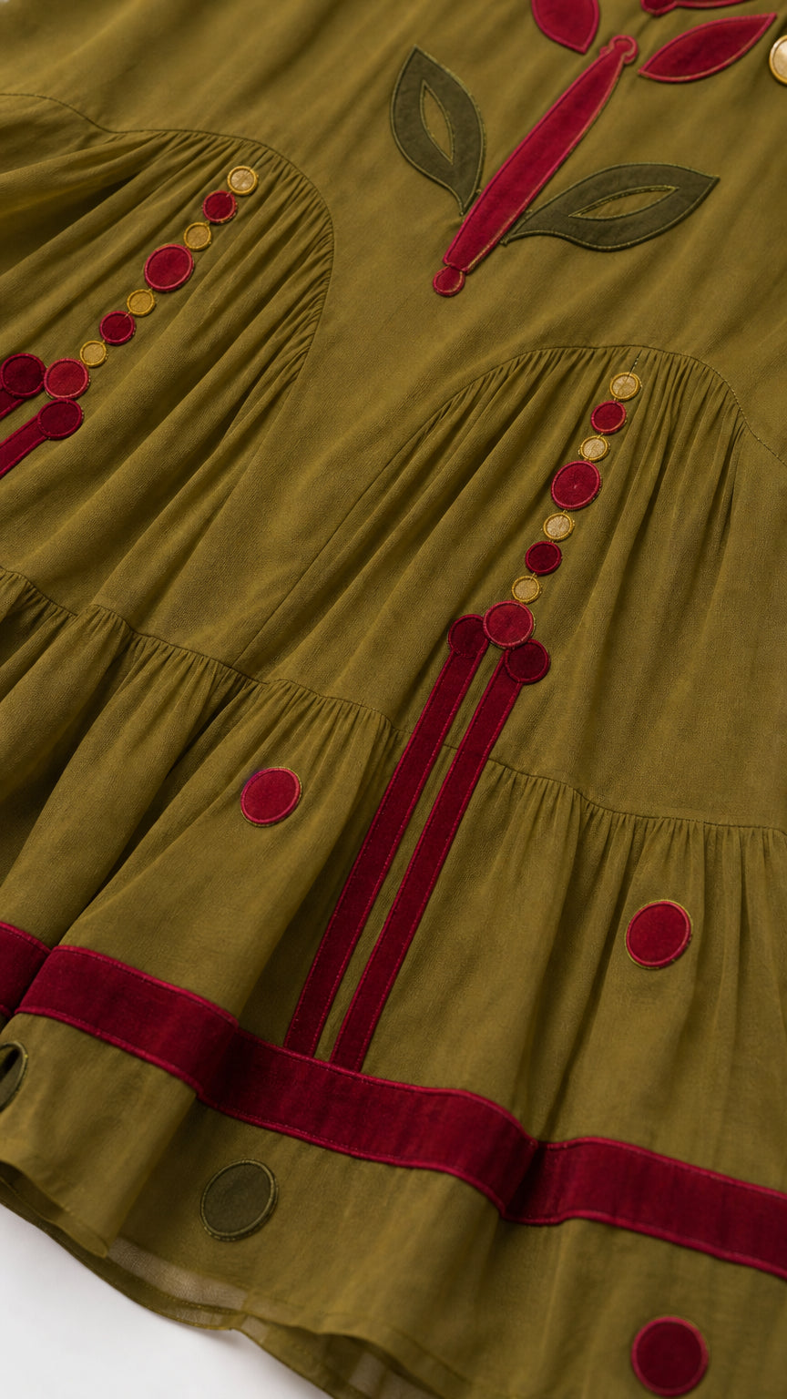 Close-up of skirt embroidery and tiered design