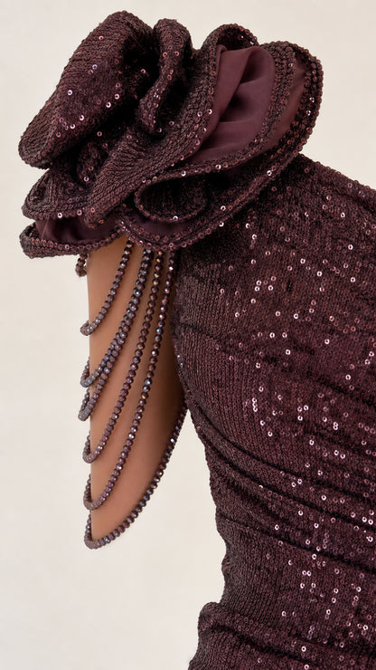 Close-up detail of 3D floral shoulder accent and beaded drapes