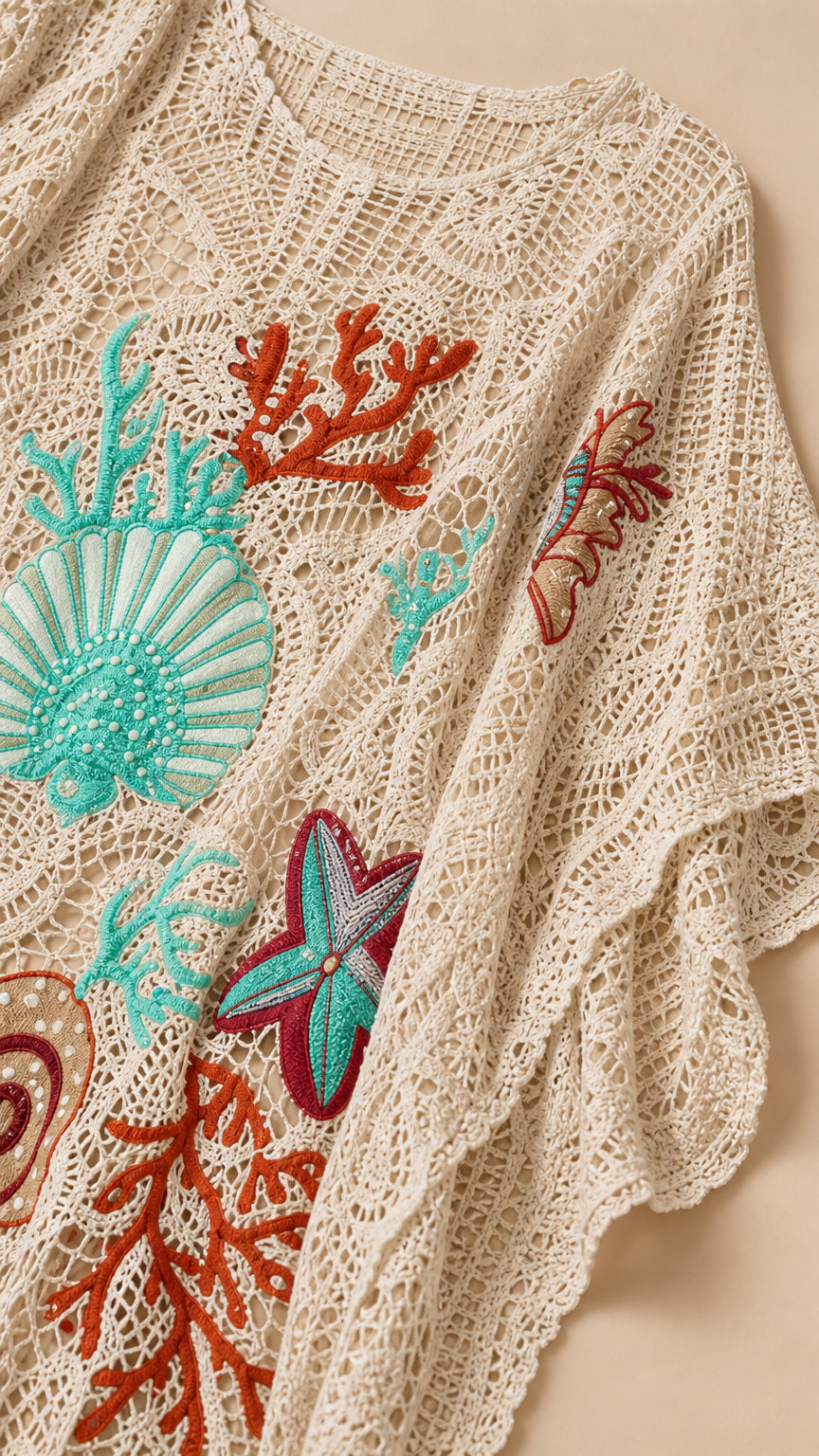 Close-up detail of sea motif embroidery on beige kaftan