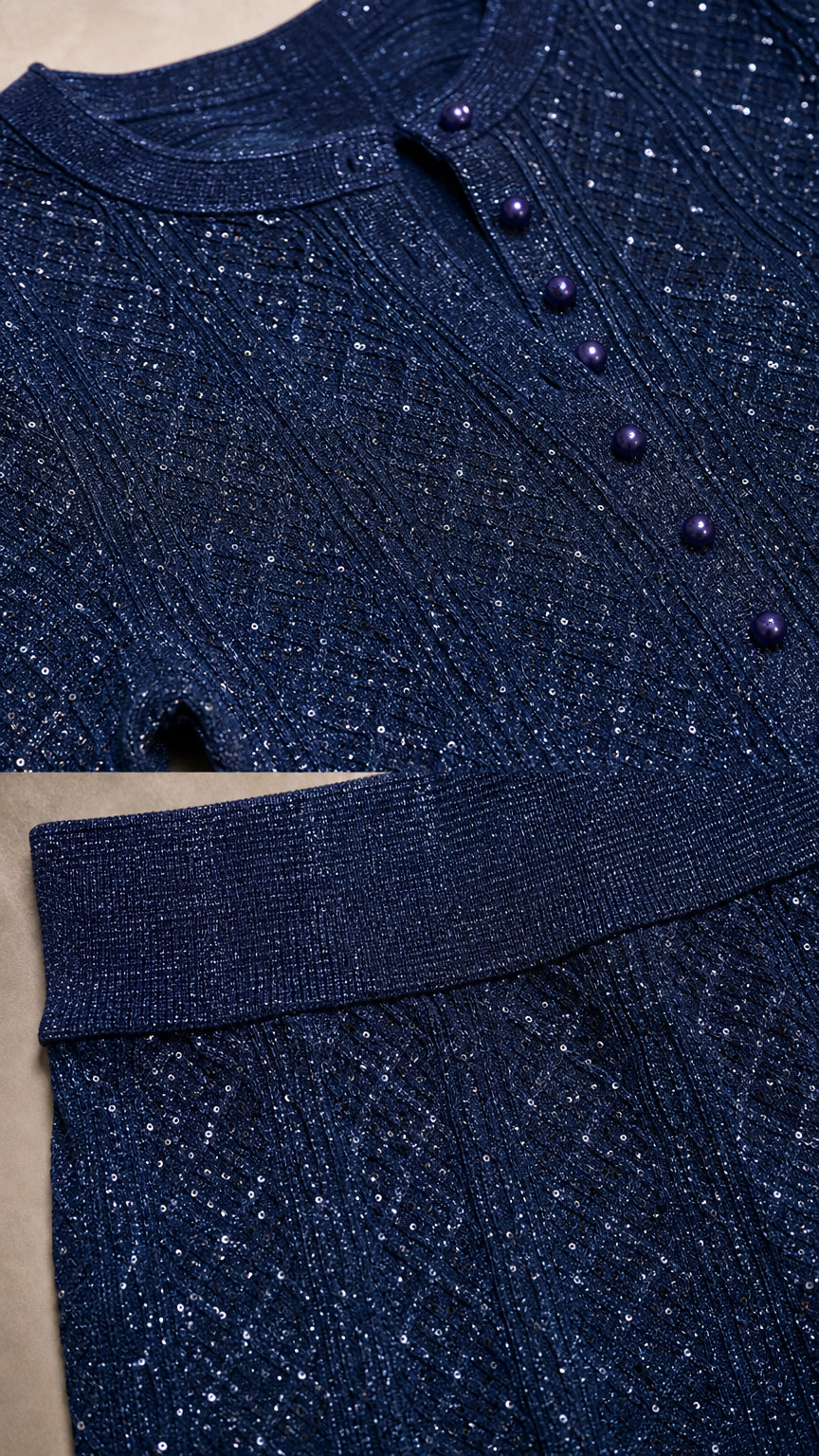 Close-up detail of navy sparkle ribbed knit fabric and covered button neckline