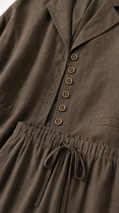Close-up detail of button closure and drawstring waistband on olive set