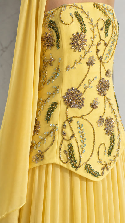 Close-up detail of floral beadwork and embroidery on the structured gown bodice