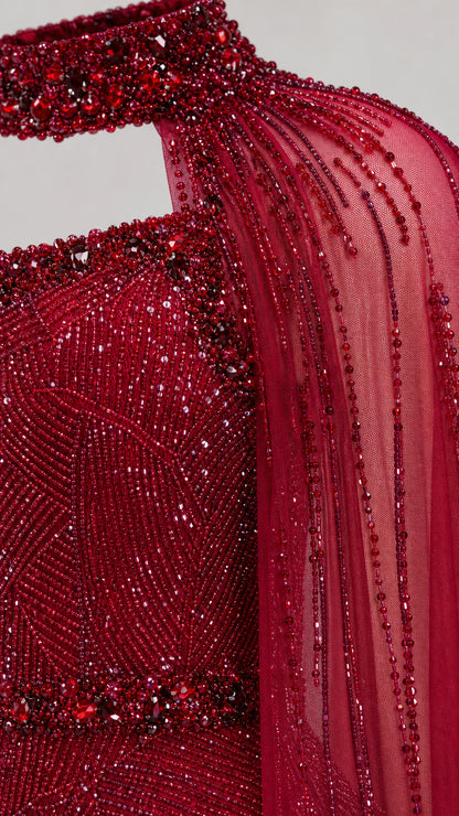 Close-up detail of burgundy sequin embellishments and high choker neckline