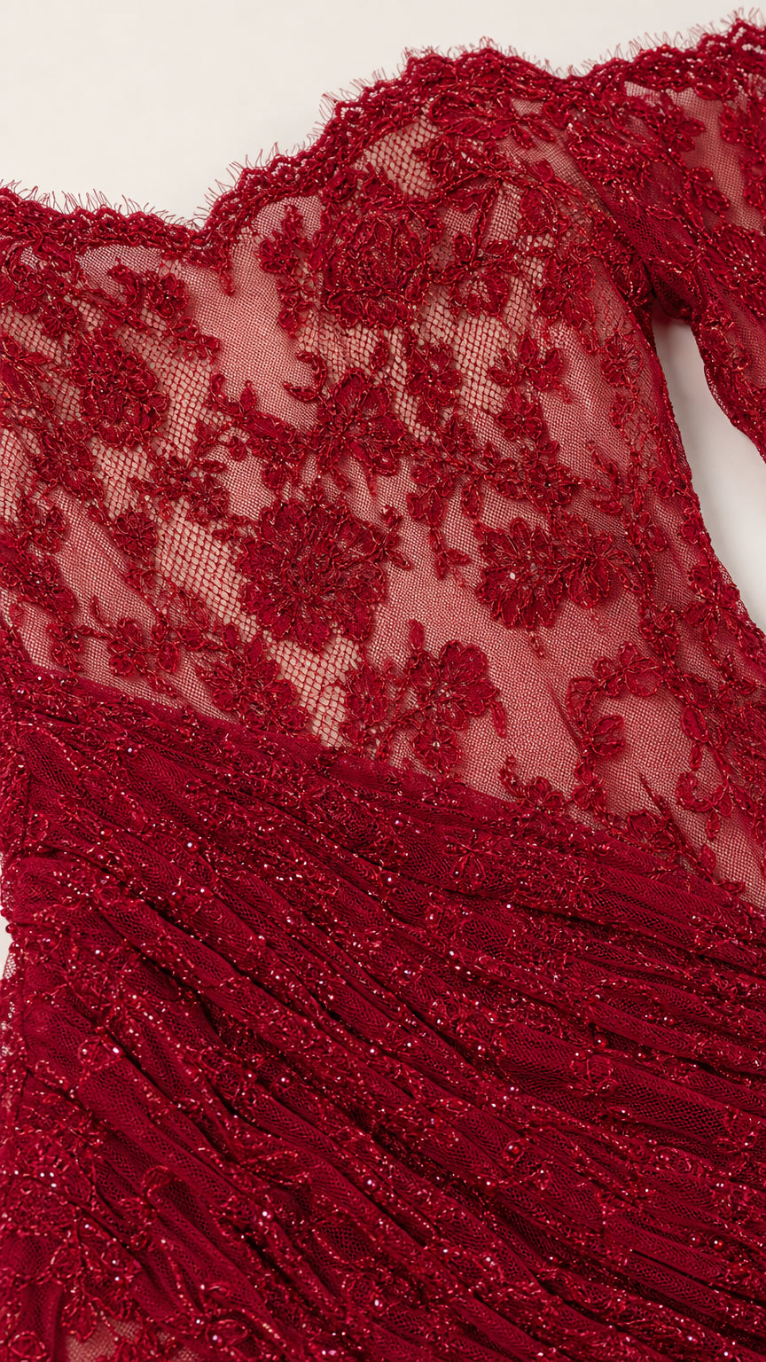 Close-up of lace pattern and texture on red evening gown