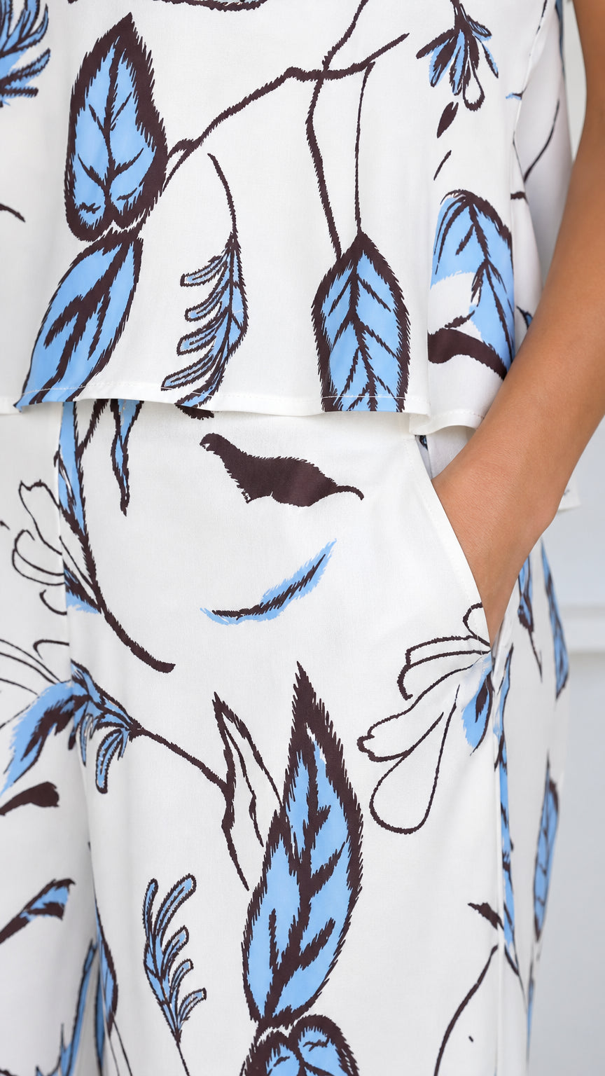 Close-up of fabric pattern and trouser pocket on white set