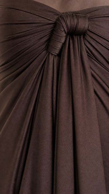 Close-up detail of the front knot and gathering on the dress