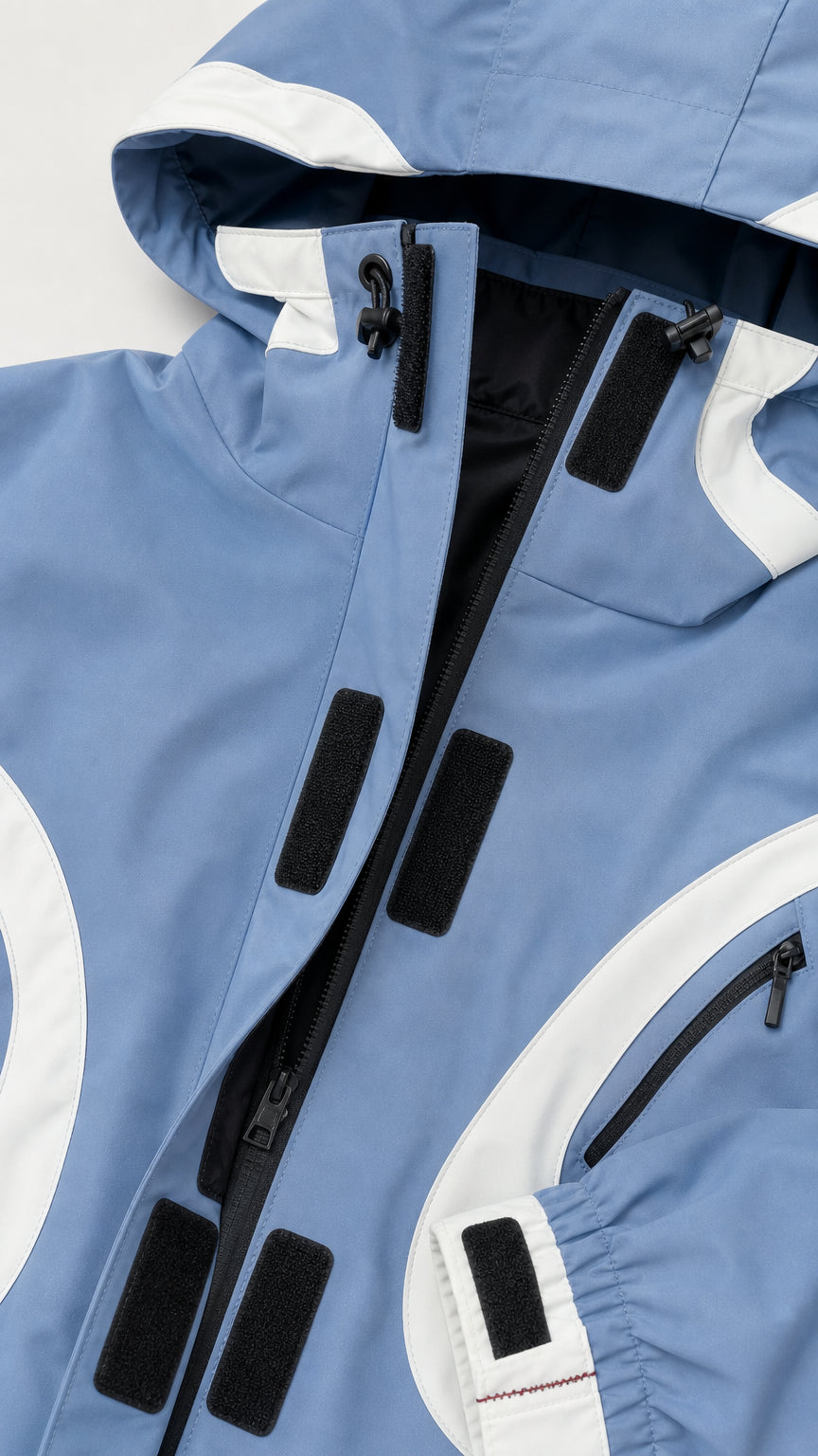 Close-up detail of zipper, hood, and collar construction