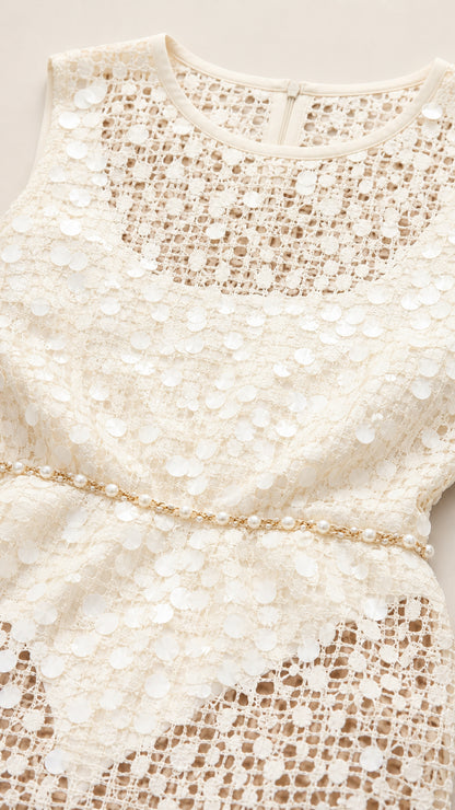 Close-up detail of neckline, crochet pattern, and waist chain