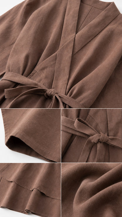 Detailed close-up of brown wrap top fabric, tie belt, and hem