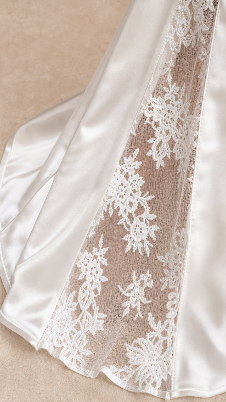 Close-up detail of the sheer lace side panel and satin fabric
