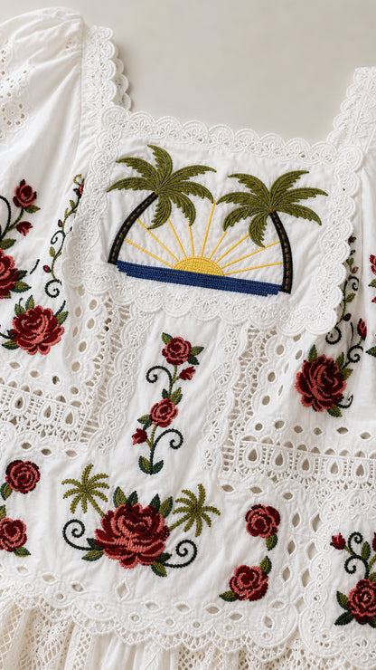 Close-up detail of square neck and palm tree embroidery