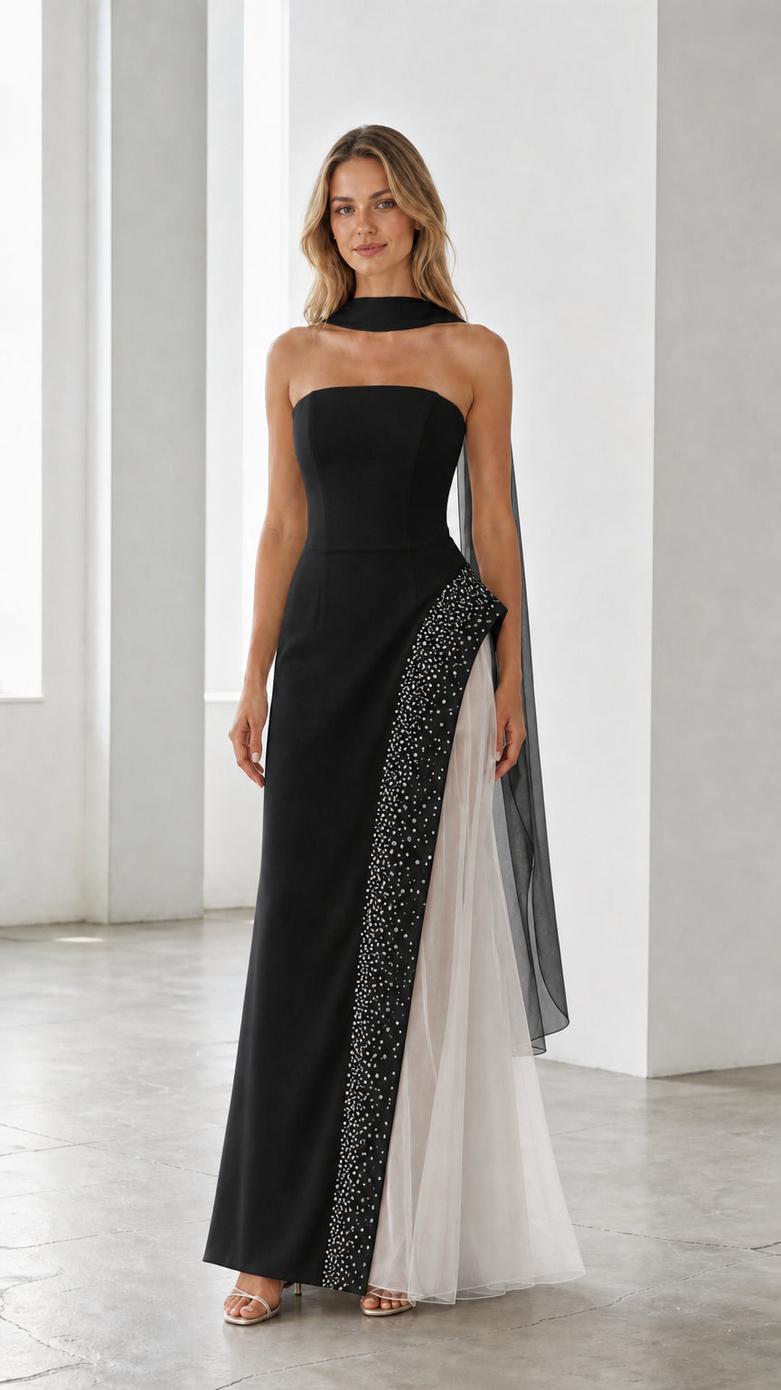 Black strapless evening gown with sheer white tulle side panel