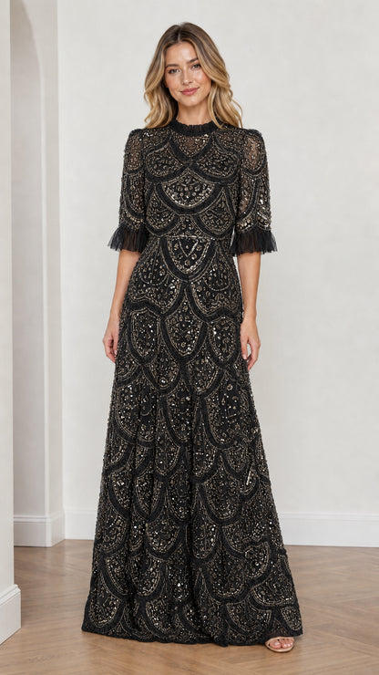Model wearing Black embellished ruffle mock neck maxi dress, front view