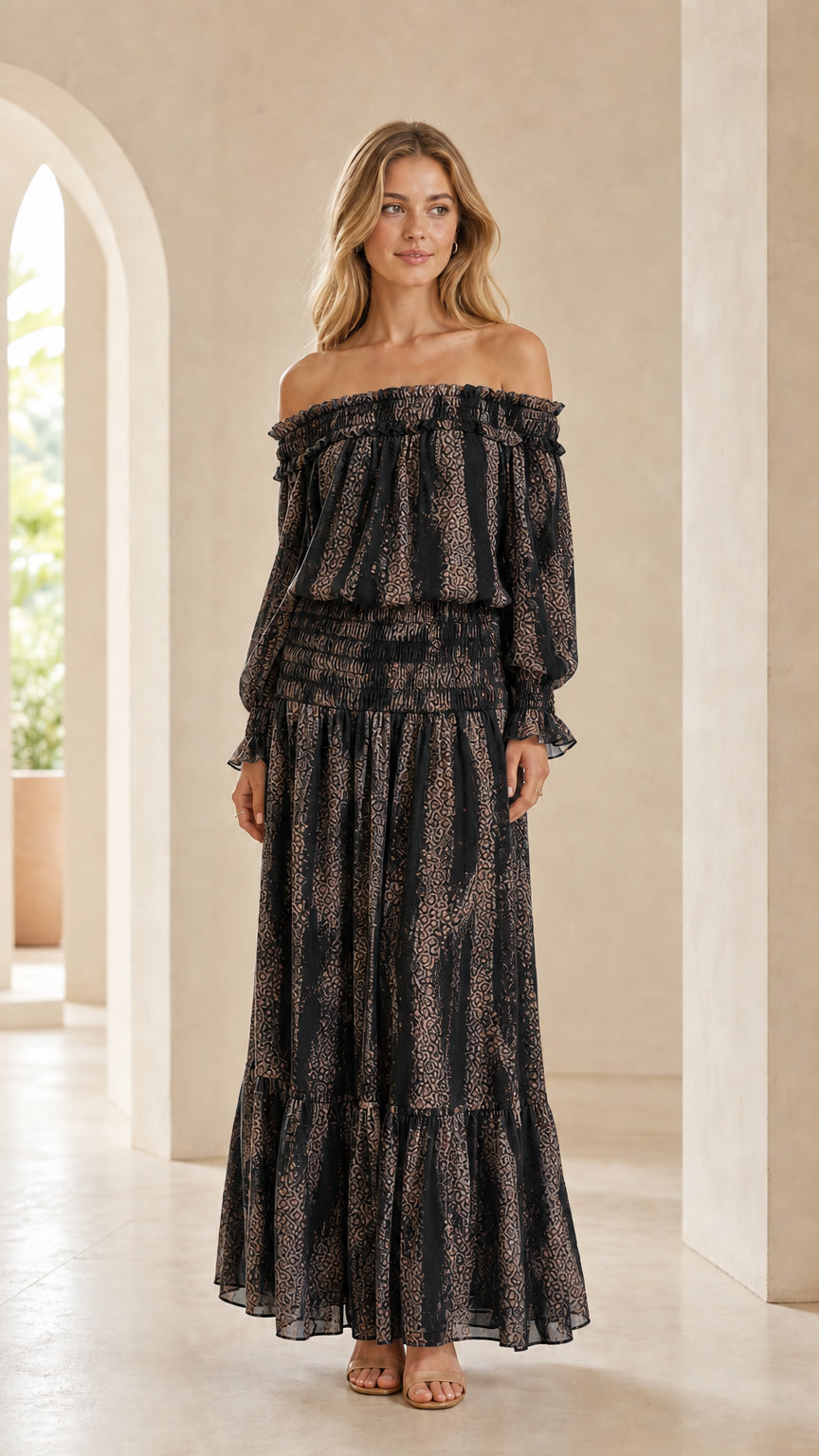 Full-length view of woman wearing Black printed off-the-shoulder smocked maxi dress