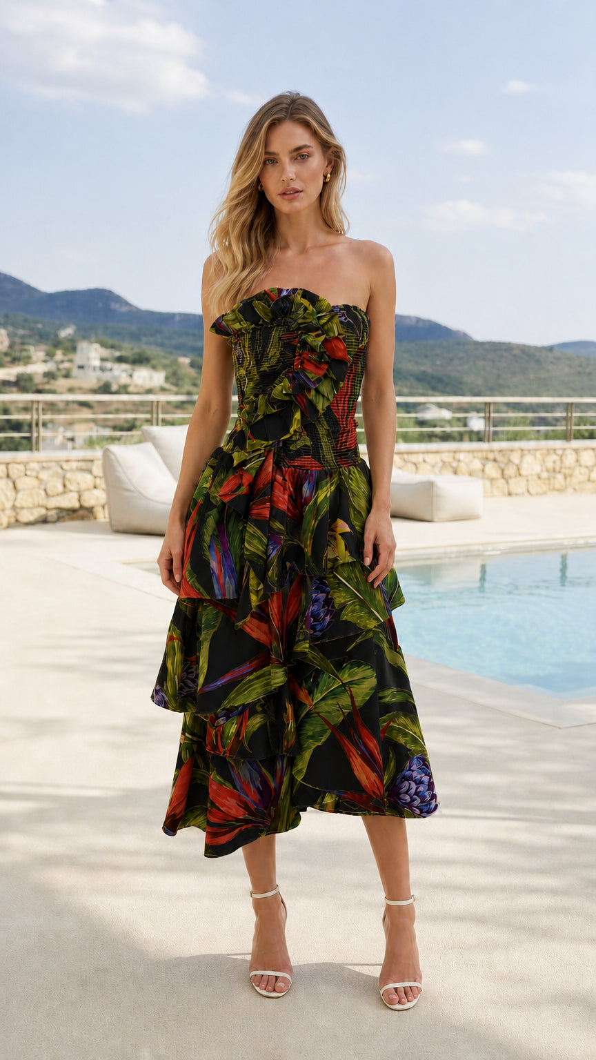 Front view of model wearing black tropical print strapless midi dress