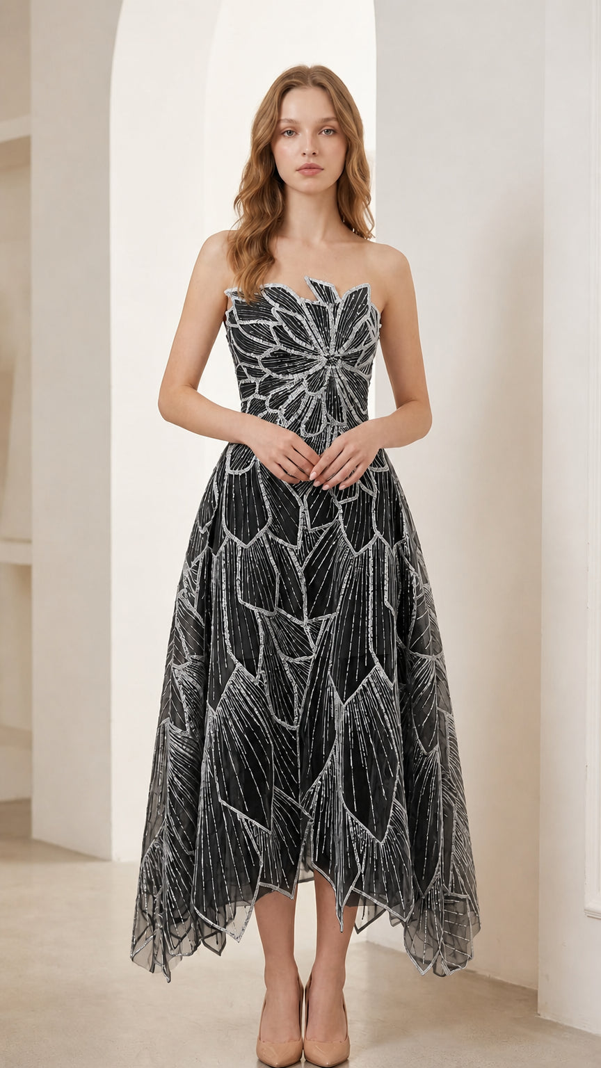 Woman wearing black strapless beaded leaf embroidery midi cocktail dress