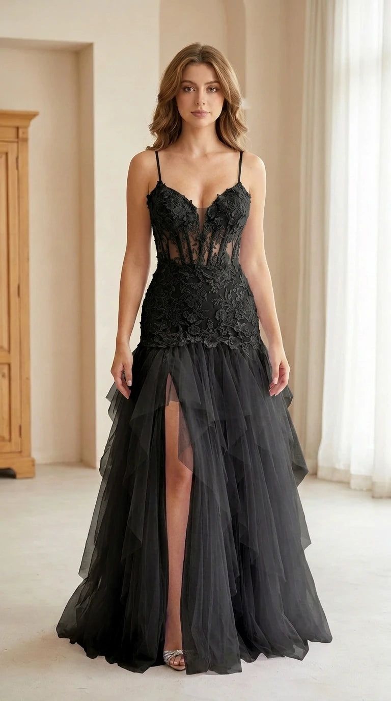 Front view of model wearing black corset tulle formal gown with slit