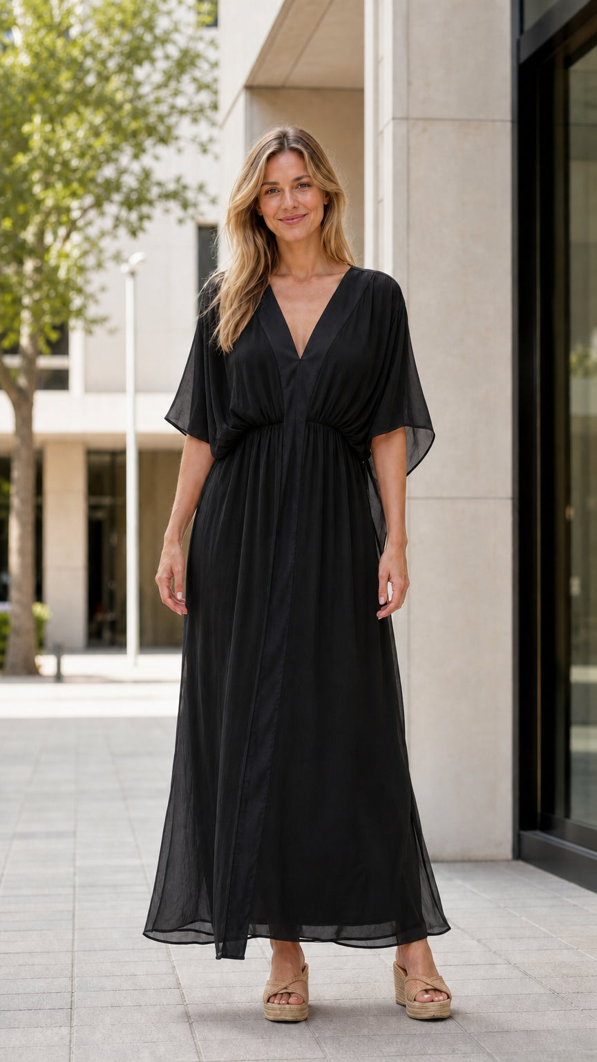 Front view of model wearing black maxi kaftan dress