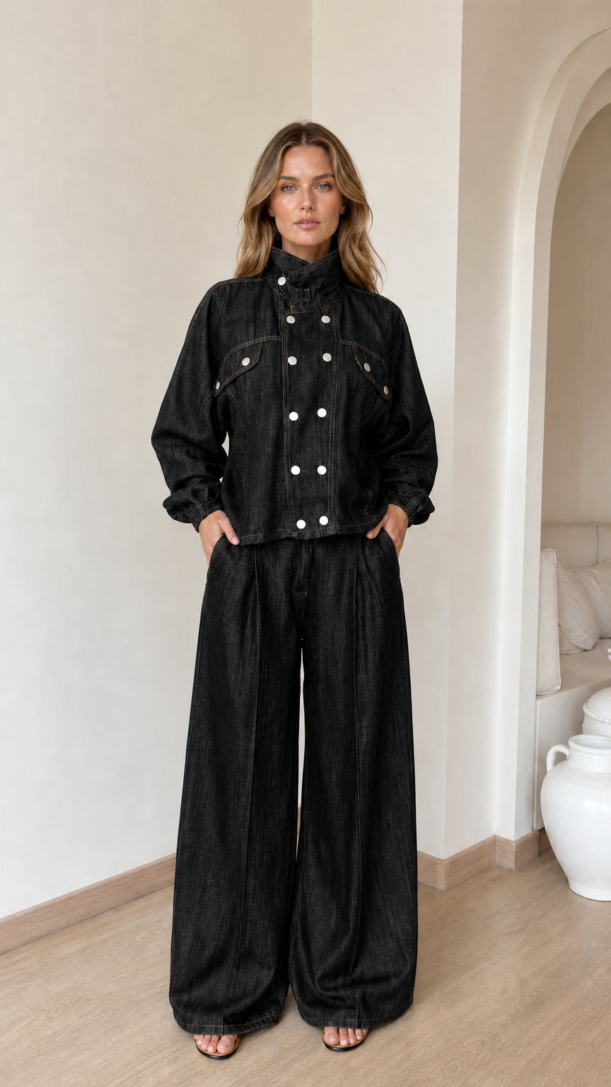 Model wearing black denim jacket and wide-leg pants set