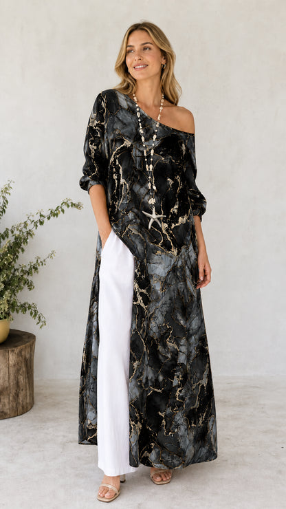 Model wearing black marble print off-shoulder maxi tunic with white pants