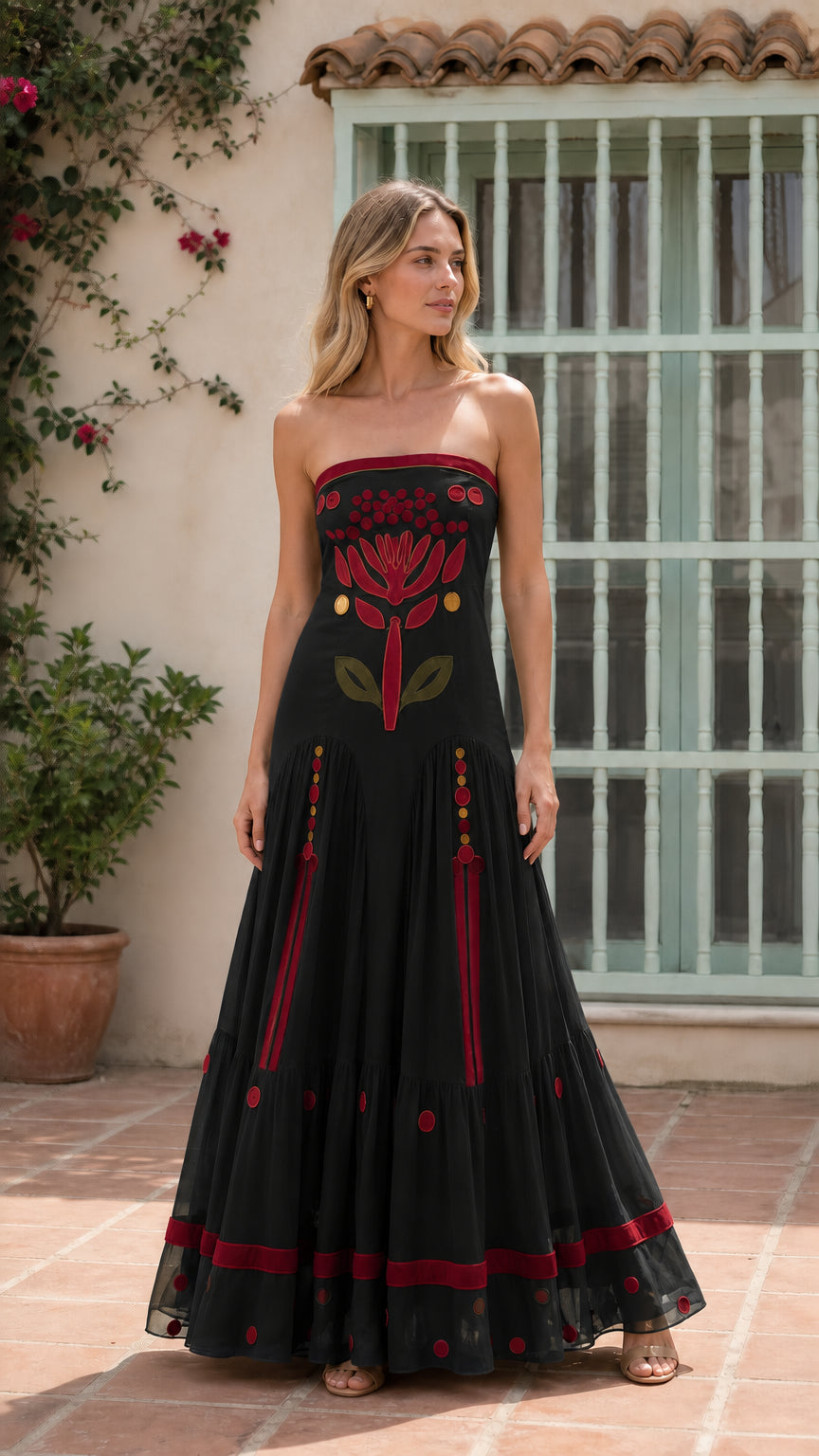 Front view of black strapless embroidered maxi dress