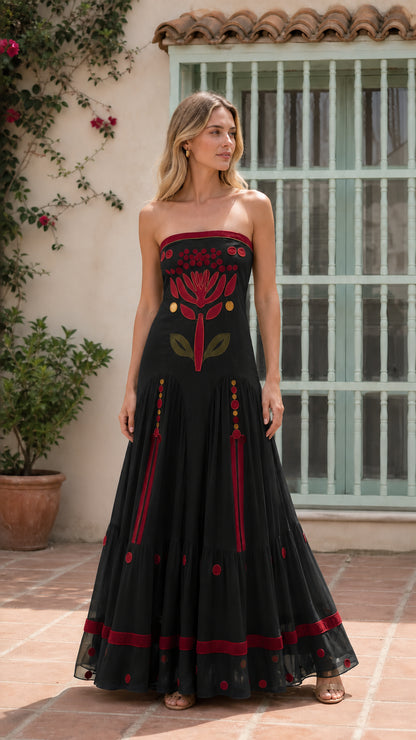 Front view of black strapless embroidered maxi dress