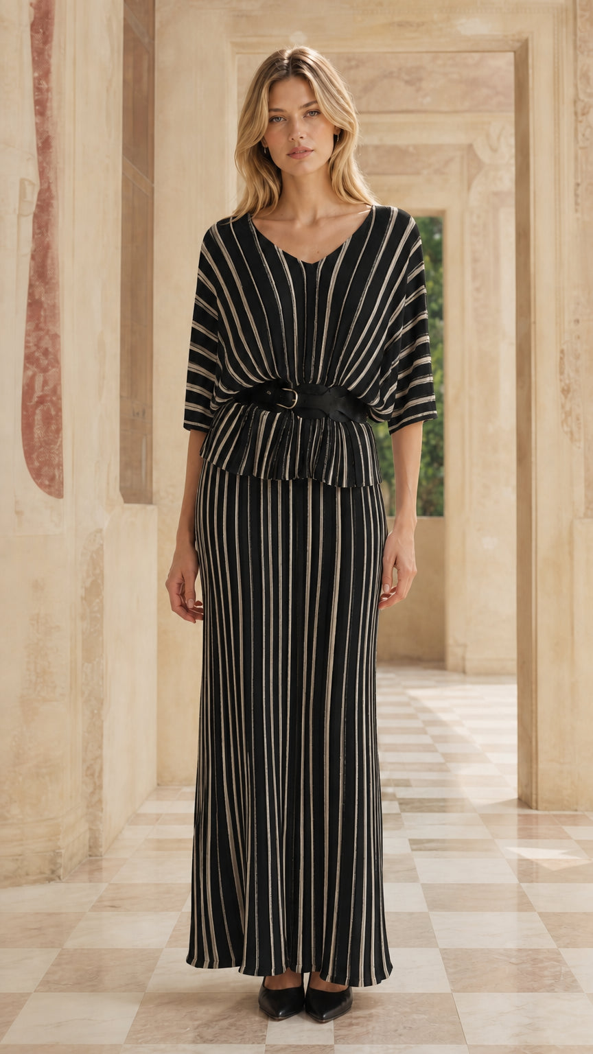 Woman wearing black striped two-piece maxi dress set