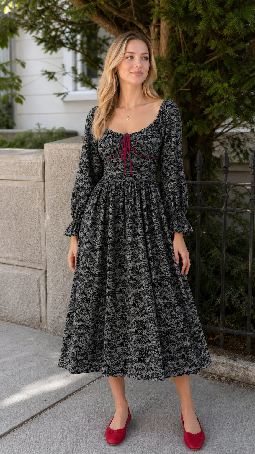 Model wearing black vintage toile print midi dress