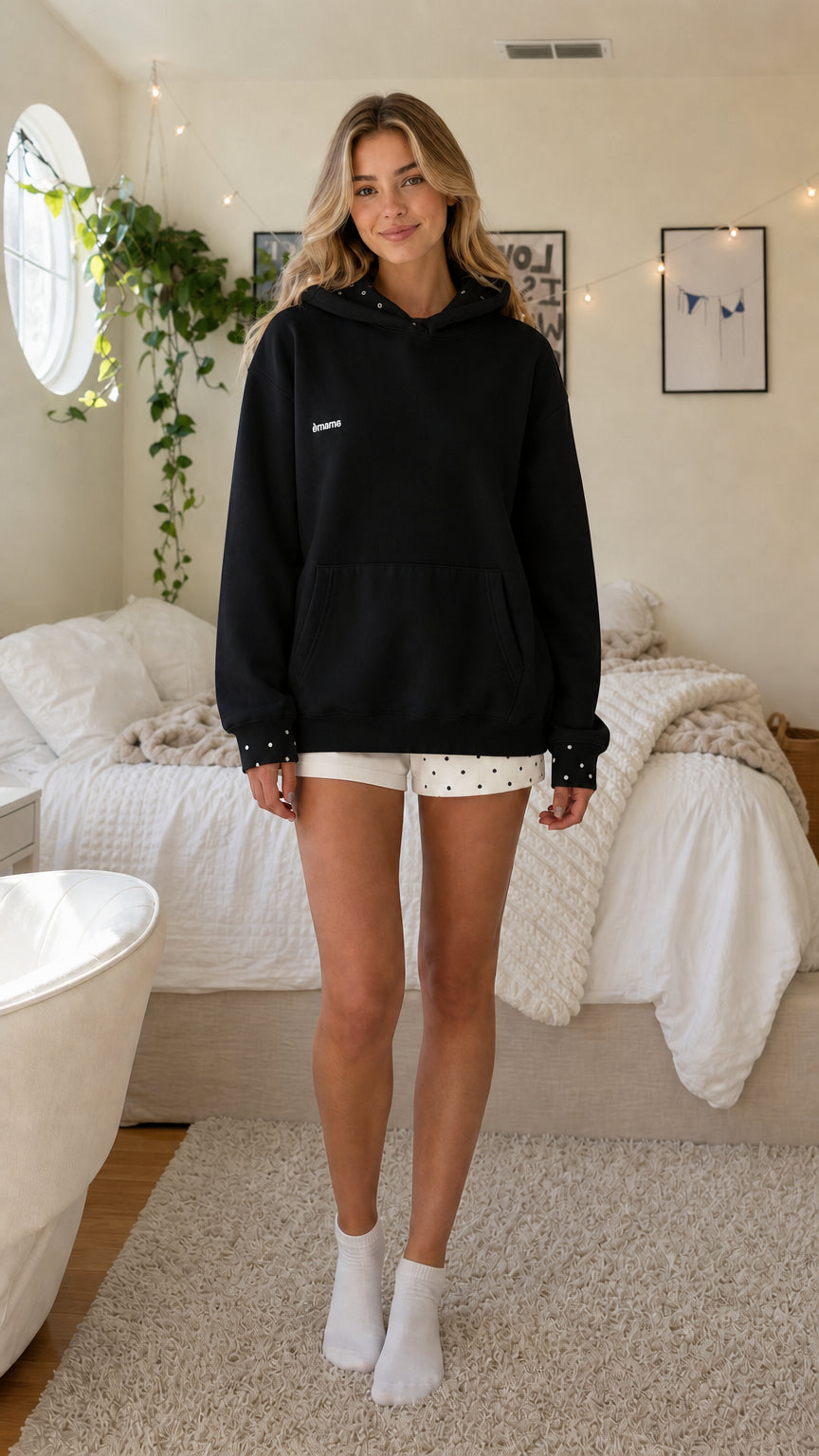 Woman wearing black casual oversized hoodie