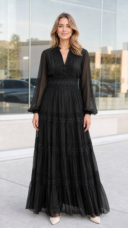 Front view of woman wearing black lace trim tiered evening maxi dress